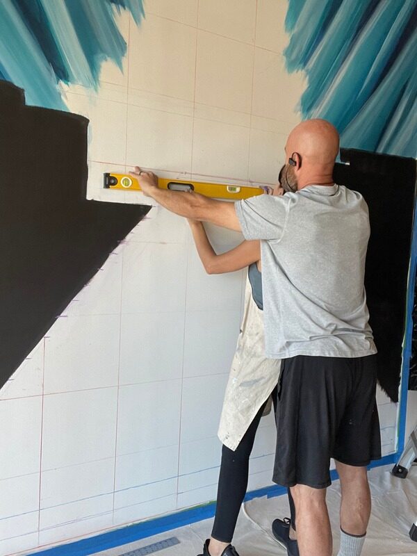 Levelling and prepping the lobby wall for the mural